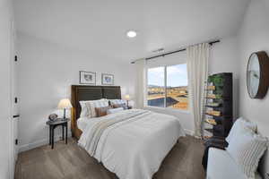 Bedroom with baseboards and carpet floors