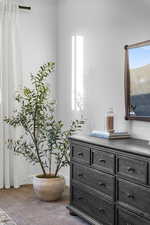 Detailed view of carpet floors and baseboards