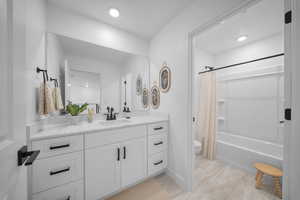 Full bath with vanity and shower / bathtub combination with curtain