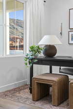 Detailed view of wood finished floors and baseboards