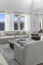 Living room featuring wood finished floors and plenty of natural light