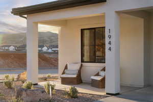 Patio terrace at dusk featuring a mountain view