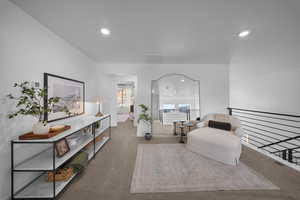 Sitting room featuring carpet floors and recessed lighting