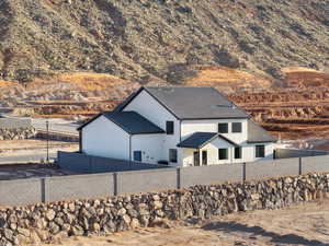 View of home's exterior featuring a mountain view and a tile roof