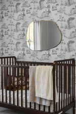 Bedroom featuring a nursery area