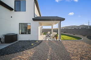 Fenced backyard with a patio area