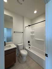 Bathroom featuring vanity, bathing tub / shower combination, and recessed lighting