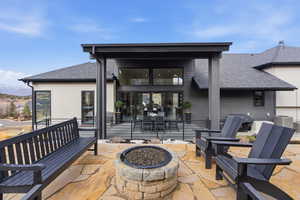 View of patio / terrace with a fire pit