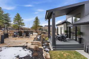 View of patio / terrace featuring outdoor dining space and a wooden deck