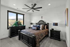 Bedroom featuring ceiling fan, light carpet, and recessed lighting