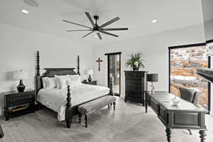 Primary bedroom featuring ceiling fan, recessed lighting, and a desk