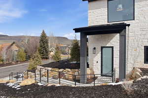Entrance to ADU featuring a mountain view and stone siding