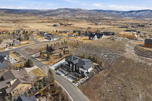 View of property location featuring nearby suburban area and a mountainous background