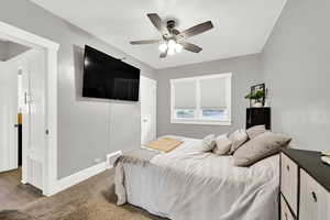 Bedroom featuring baseboards and a ceiling fan