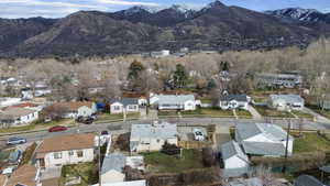 Aerial view of residential area featuring a mountain backdrop