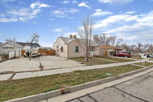 View of front of property featuring a residential view and driveway