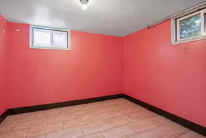 Basement featuring baseboards