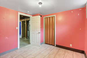 Unfurnished bedroom featuring baseboards