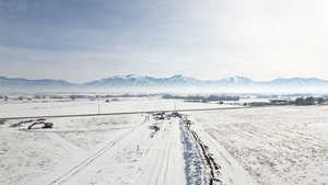 Snowy aerial view featuring a mountain view