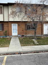 View of front facade featuring brick siding