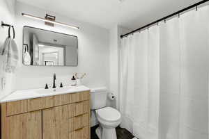 Bathroom with vanity and a shower