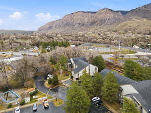 Aerial perspective of suburban area with a mountainous background