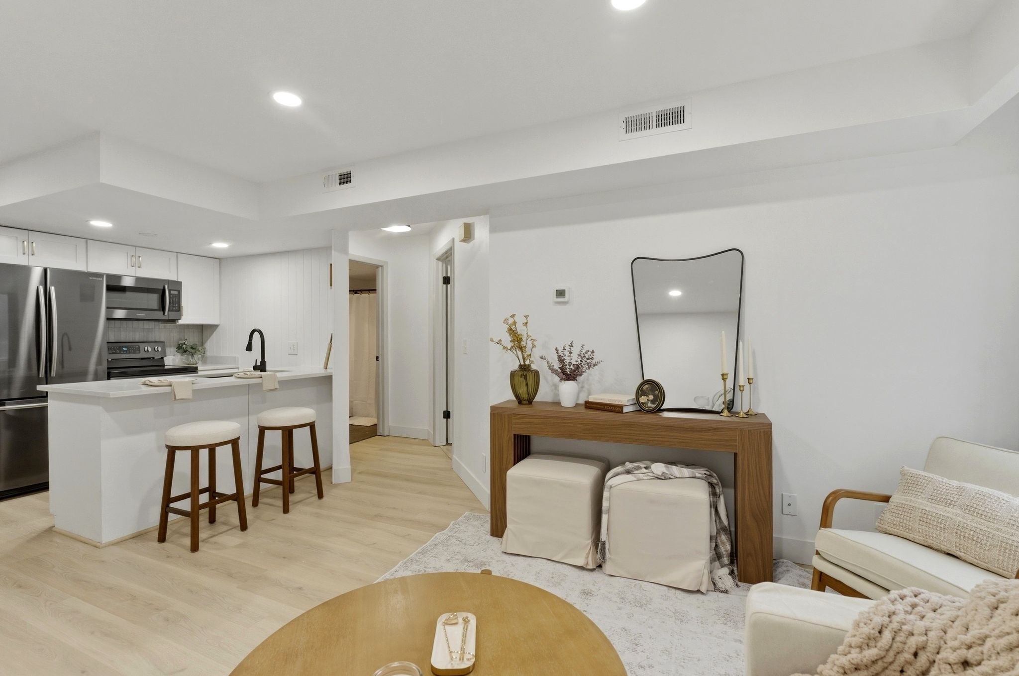 Living room featuring recessed lighting and light wood-type flooring