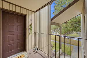 Property entrance featuring board and batten siding