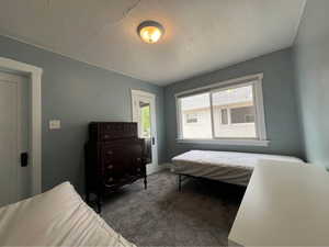 Bedroom with carpet flooring and baseboards