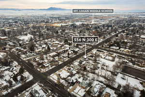 Snowy aerial view featuring a mountain view