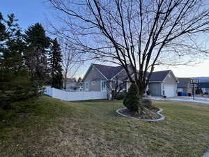 View of home's exterior featuring stucco siding and a garage