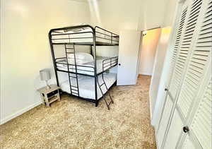 Bedroom with baseboards and a closet