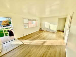 Unfurnished room with light wood finished floors