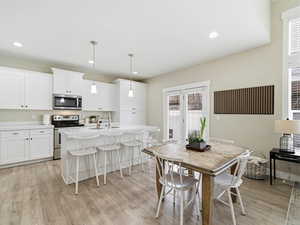 Kitchen with upgraded quartz countertops & large center island with counter seating