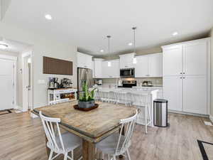 Dining space with natural light from french door and large windows