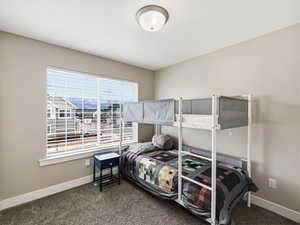 Bedroom with blinds, carpet and french door wide closet