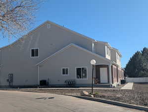 View of home's exterior featuring a cooling unit