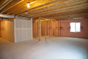Unfinished basement with potential for a full bath, one bedroom and large family room.