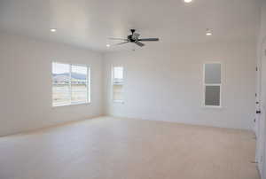 Large family room with 9' ceiling and ceiling fan.