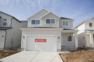 Front view of Forrest Elevation A with front yard to be installed.