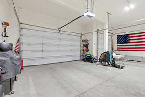 Garage featuring a garage door opener
