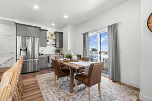 Dining area featuring light wood-type flooring and recessed lighting