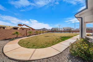 Fenced backyard with a residential view