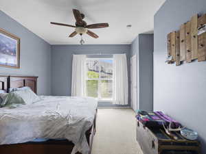 Bedroom featuring carpet flooring and a ceiling fan