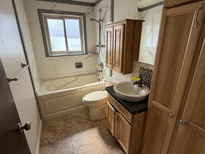 Full bath featuring vanity and shower / bath combination