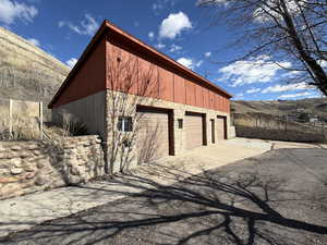 Detached garage featuring a mountain view