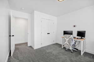 Office with carpet and baseboards