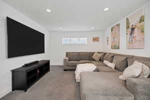 Living area featuring carpet flooring and recessed lighting