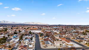 Aerial view of residential area featuring a mountain backdrop