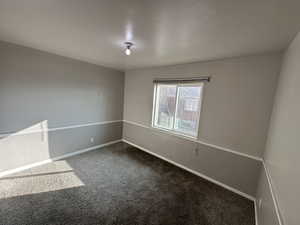 Spare room with carpet flooring and baseboards